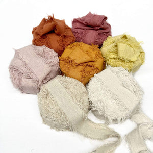 rust rose bisqua butternut lemon oat natural snow frizz ribbon roll combination photo on white background