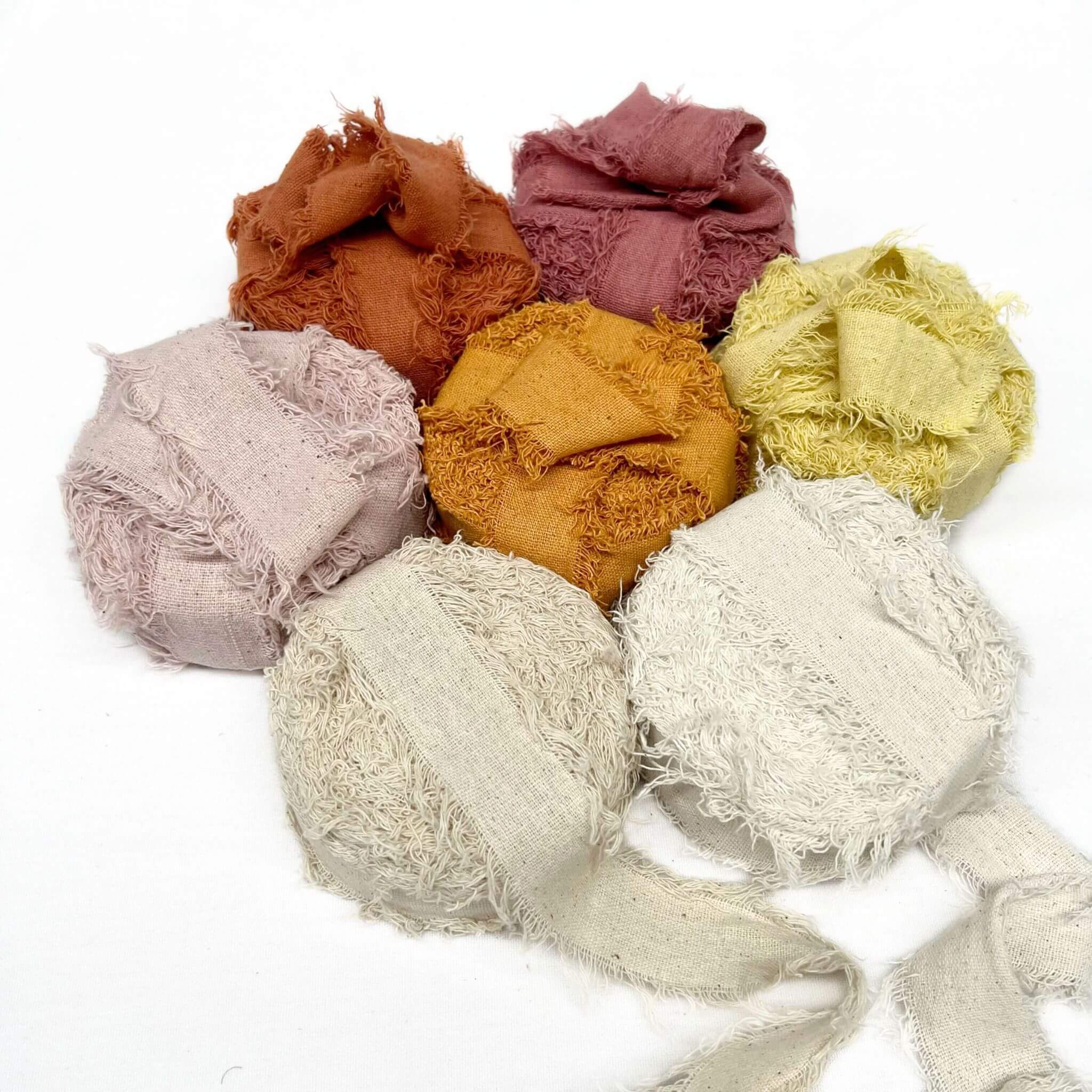 rust rose bisqua butternut lemon oat natural snow frizz ribbon roll combination photo on white background