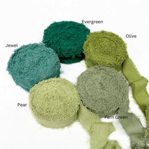 deep green olive green vintage green pear jewel green wide frizz ribbon in group photo three rolls unravelled to show texture