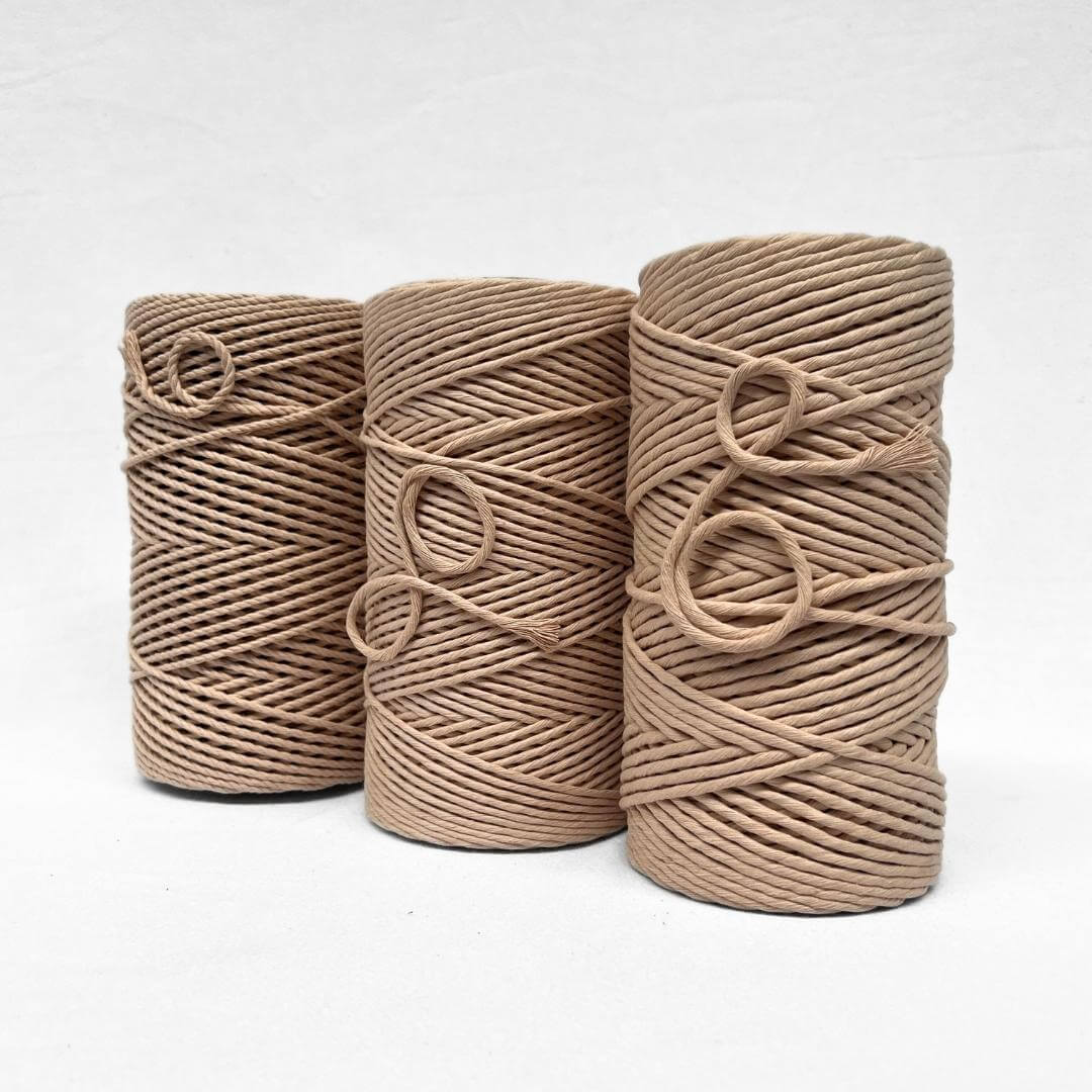 combination photo showing the different sizes of the soft string macrame cord on white wall