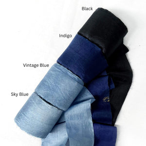black indigo vintage blue sky blue silk ribbon on white background