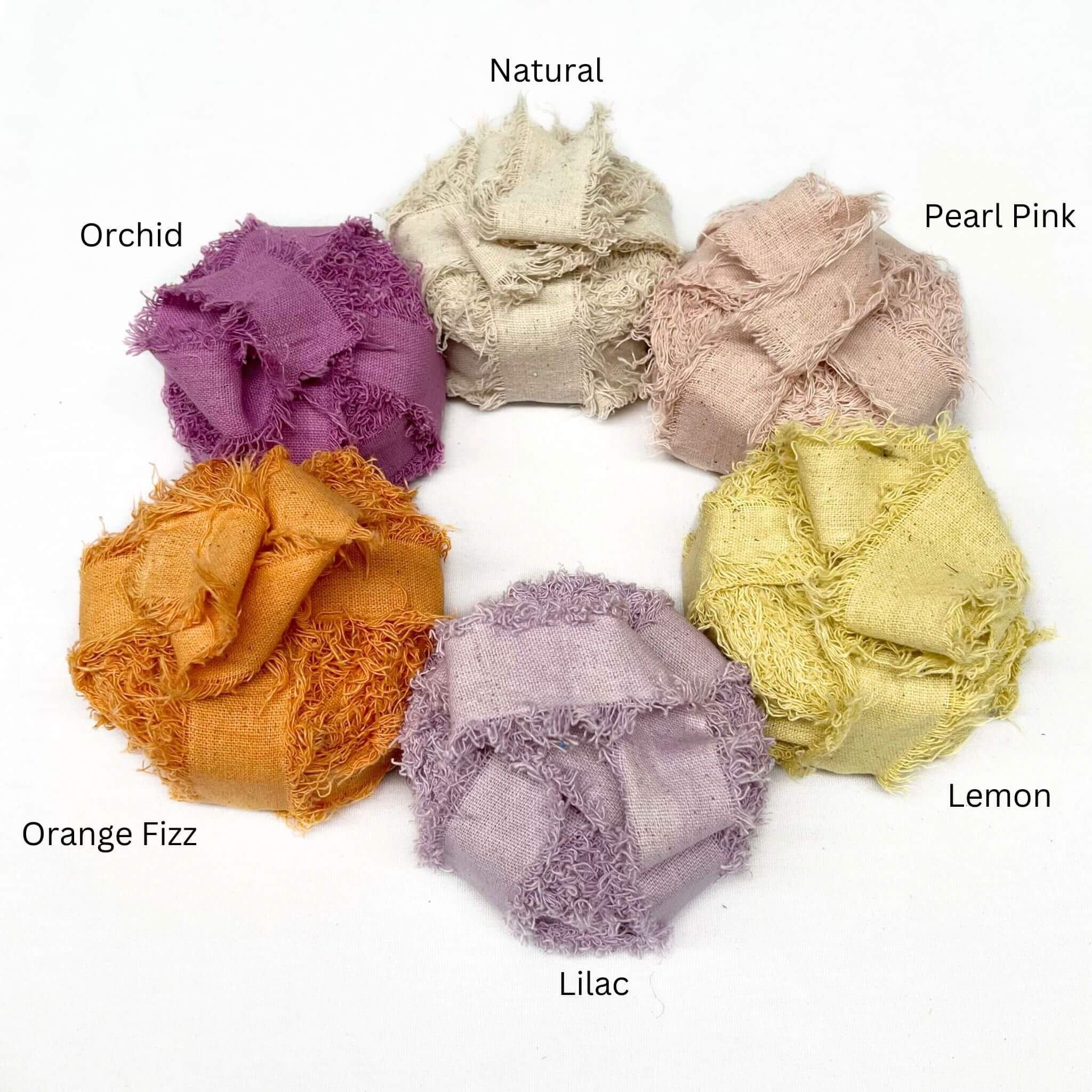 natural pearl lemon yellow lilac vibrant range orchid purple combination photo of cotton frizz ribbon on white background