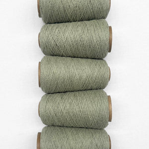 5 rolls of sage green wool rope laying side by side in flat lay image on white background