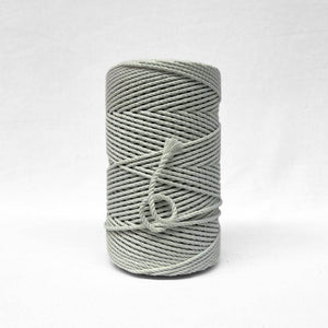 soft muted icy green 3ply 4mm cotton recycled rope on white backdrop small brushed piece to highlight the products softness