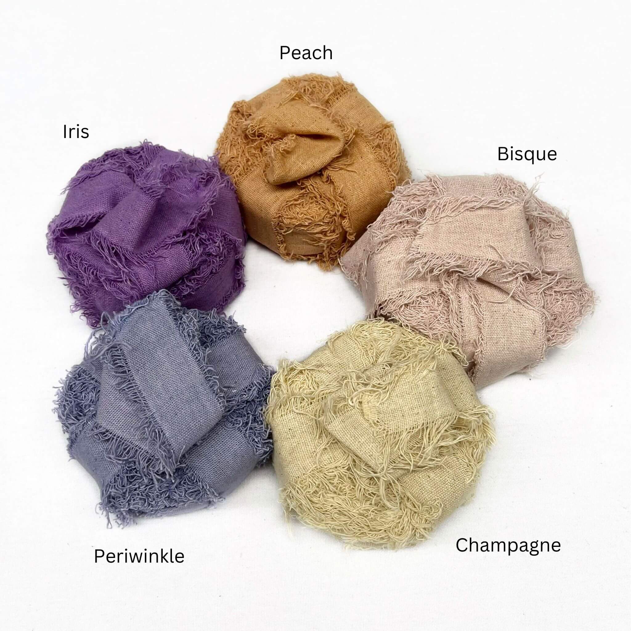 peach bisque pink pastel yellow periwinkle deep purple  frizz cotton ribbon combination photo on white back drop