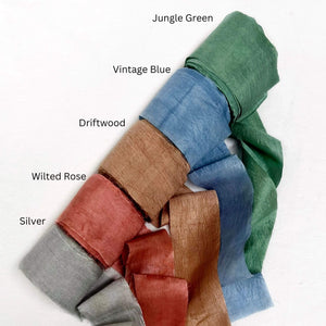 dark green vintage blue driftwood brown rose red silver grey wide silk ribbon rolls group photo for diy craft on white wall