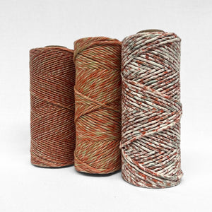 combination image showing red and green colour way in 1.5mm mixed string 4mm mixed string and confetti string standing upright on white background