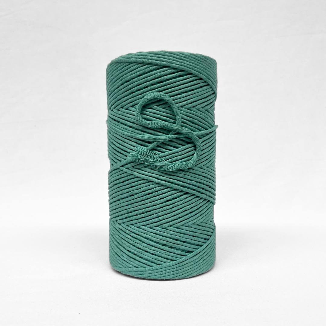 3mm blue turquoise cotton string standing alone on white back drop