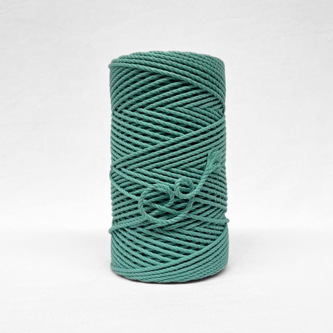 turquoise blue 4mm 3ply cotton cord image showcasing single rolls standing upright on white background