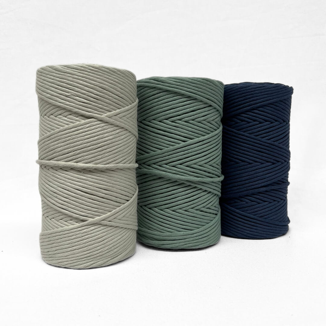 colour group photo showing soft green middle green and deep navy blue on white background