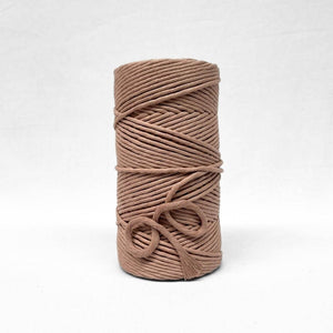 5mm shell pink cotton string on white backdrop showing muted tone and texture