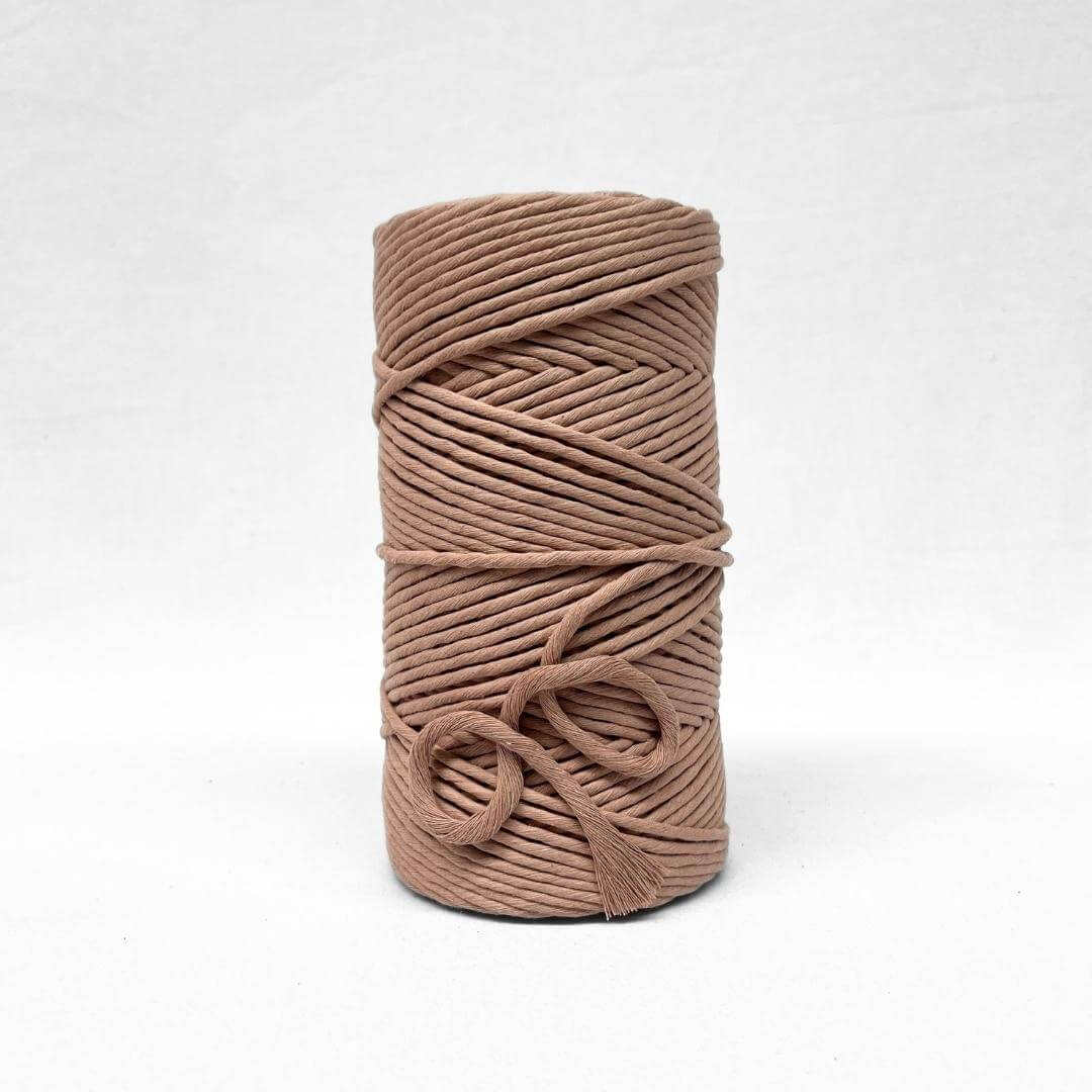 5mm shell pink cotton string on white backdrop showing muted tone and texture
