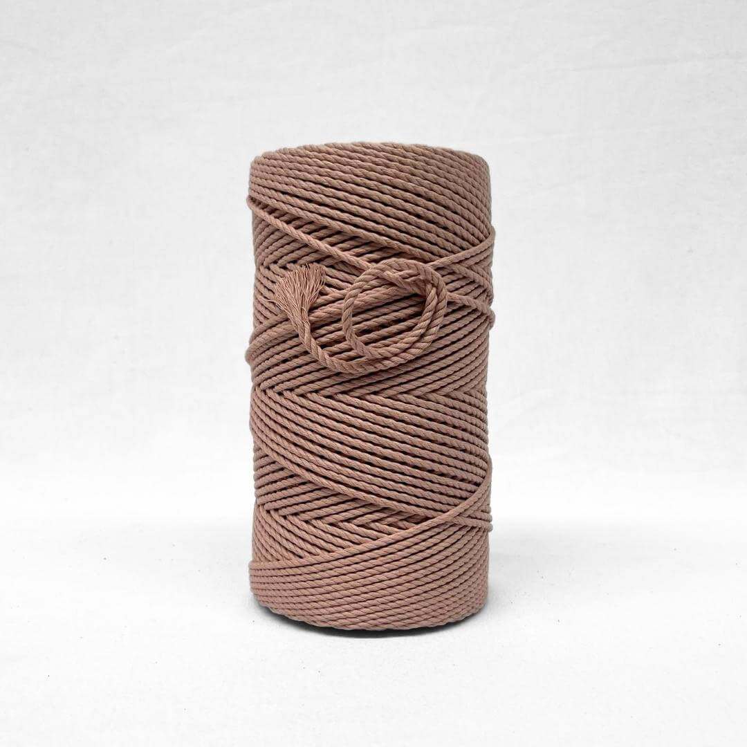 muted vintage pink 4mm rope for macrame and weaving standing alone with white backdrop, small brushed out piece demonstrating texture and softness