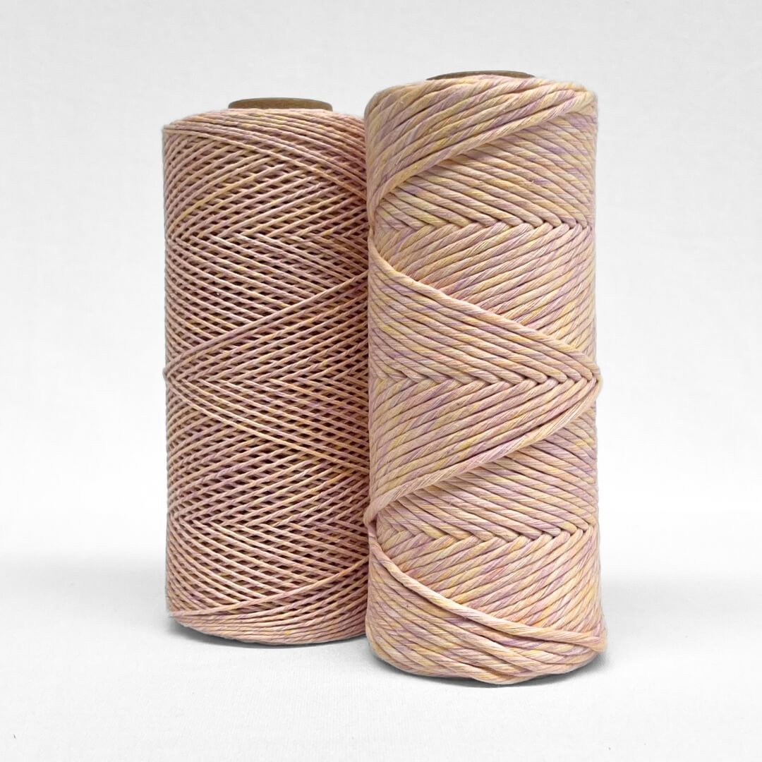 pastel lilac and orange mixed macrame string in 4mm and 1.5mm stnaind on white background