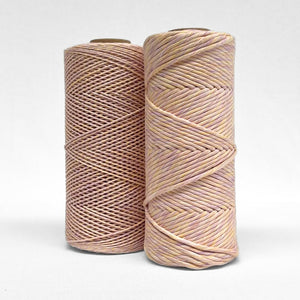 pastel lilac and orange mixed macrame string in 4mm and 1.5mm stnaind on white background