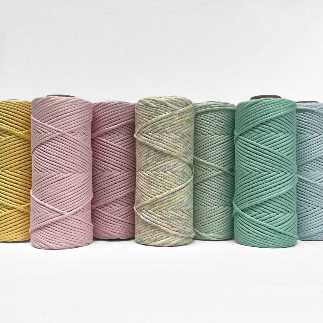 image showing fruit tingle macrame string  and six of its complementing colours on white background