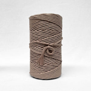 one roll of quartz 5mm macrame string on white background