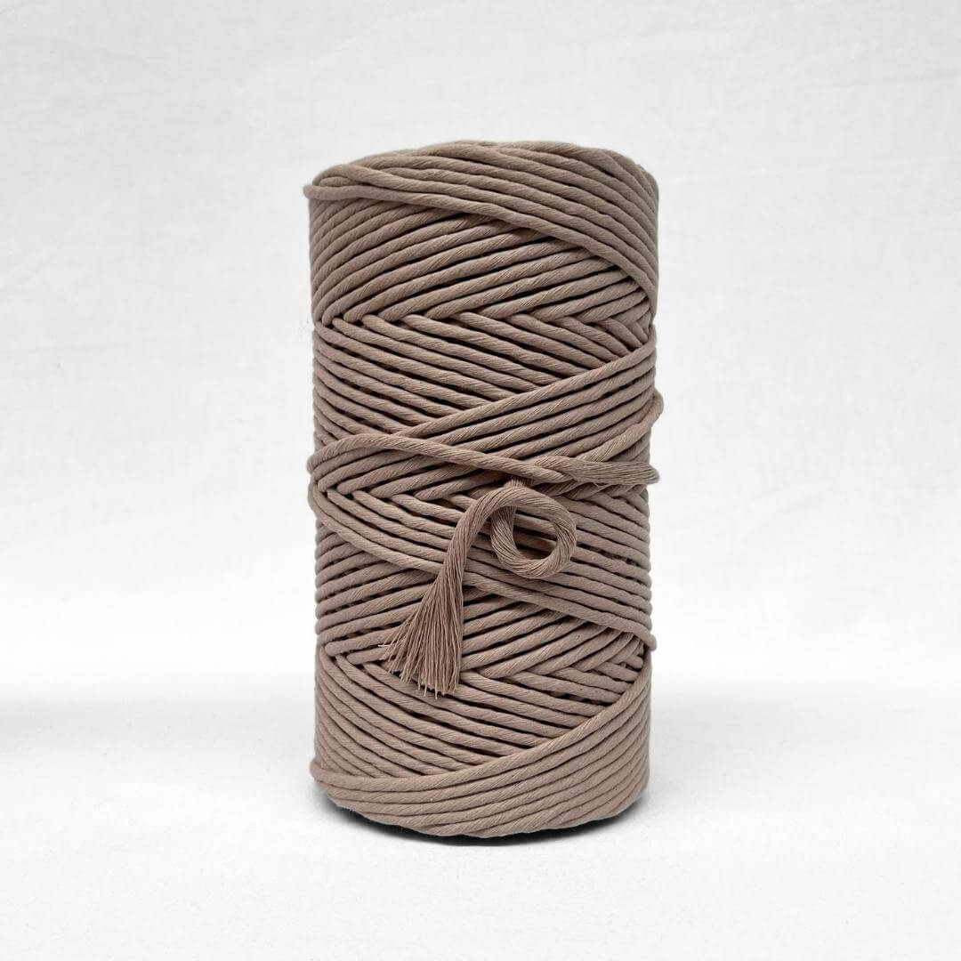 one roll of quartz 5mm macrame string on white background