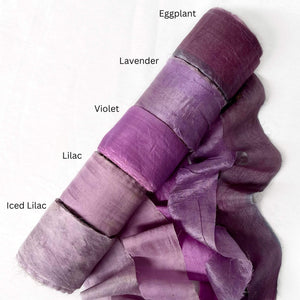 eggplant deep purple lavender vibrant purple lilac sift purple group image of silk ribbon rolls for gift wrapping on white background