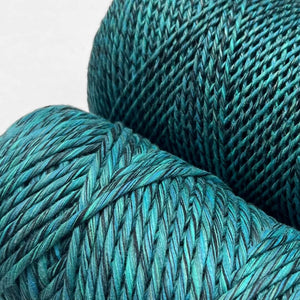 close up image of two rolls of aura blue cotton cord one roll 1.5mm and the other 4mm laying flat on white background