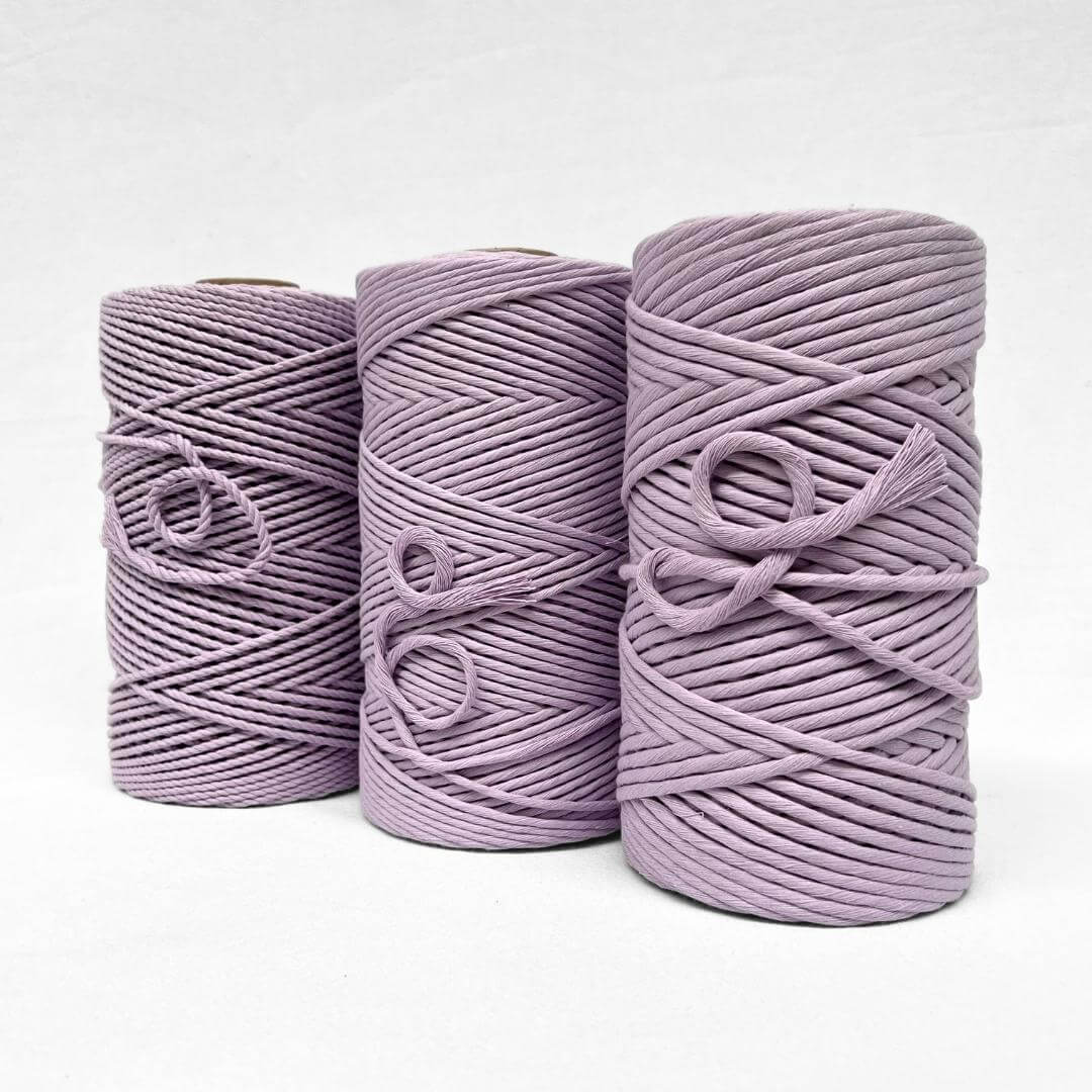 4mm 3ply orchid purple macrame cord standing upright on white background