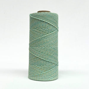 roll of 1.5mm lime and yellow mixed amcrame cord standing on white background