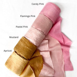 candy pink flamingo pink pastel pink mustard and apricot muted orange silk ribbon for florist group photo on white background