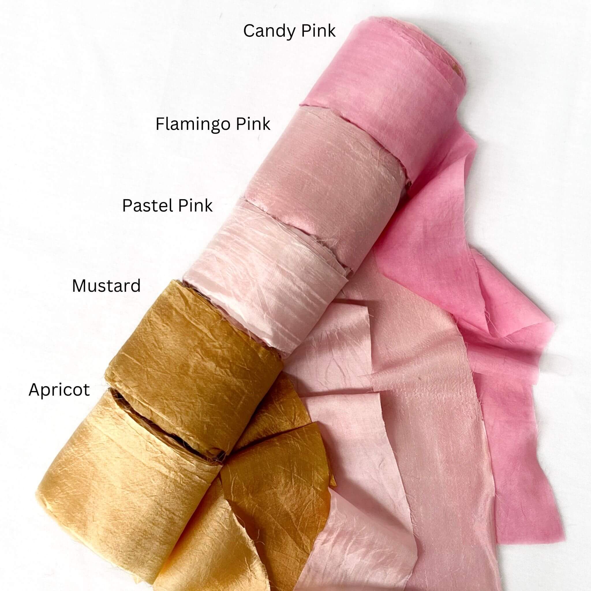 candy pink flamingo pink pastel pink mustard and apricot muted orange silk ribbon for florist group photo on white background