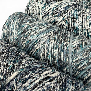 close up of three rolls of cosmic blue confetti cord blue and black watercolour mix on white background