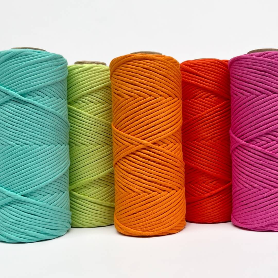 five rolls of various neon colours in our cloud 9 macrame string including mint, green, orange, red and pink