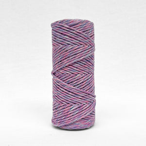 single roll of 4mm mixed string in lavender skies colourway standing upright on white background