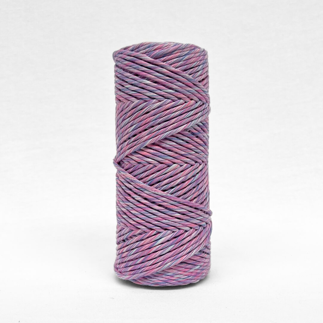 single roll of 4mm mixed string in lavender skies colourway standing upright on white background