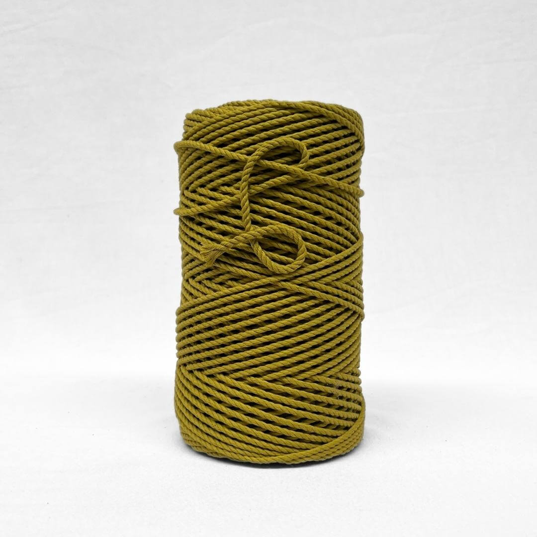 image of single roll of chartreuse yellow cotton rope on white background