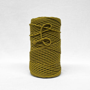 image of single roll of chartreuse yellow cotton rope on white background