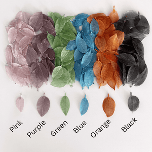 pink purple green blue orange and black metal filigree leaves labelled and lined up to show difference in colour and size