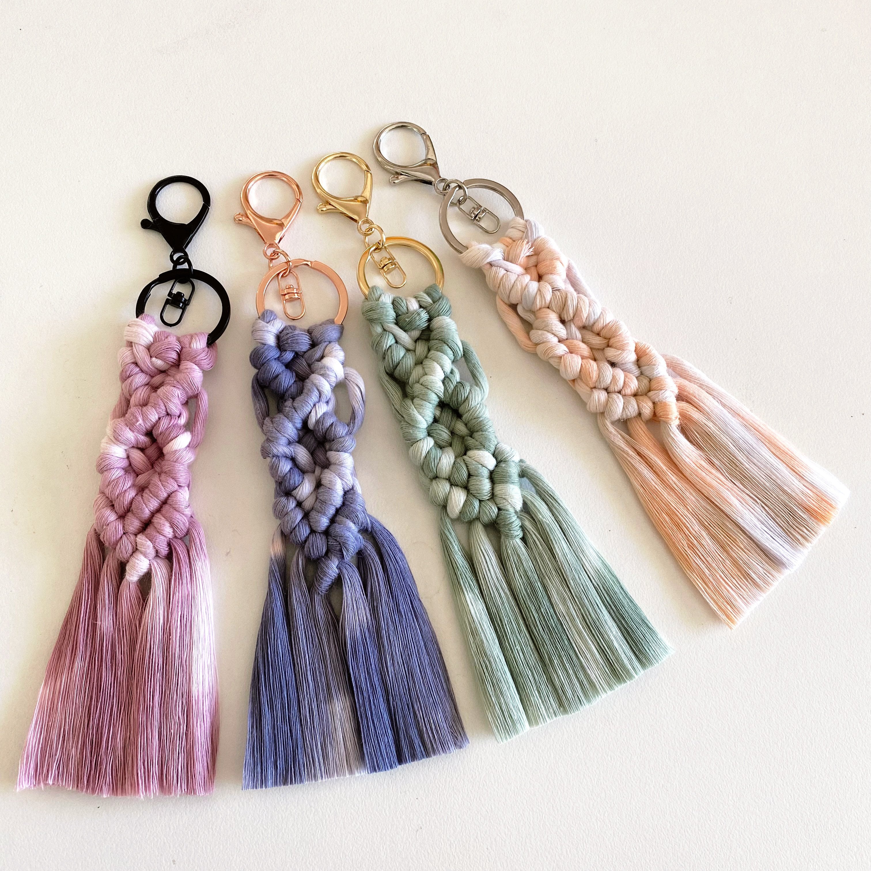 handpainted macrame corron with multicoloured keyrings displayed on desk