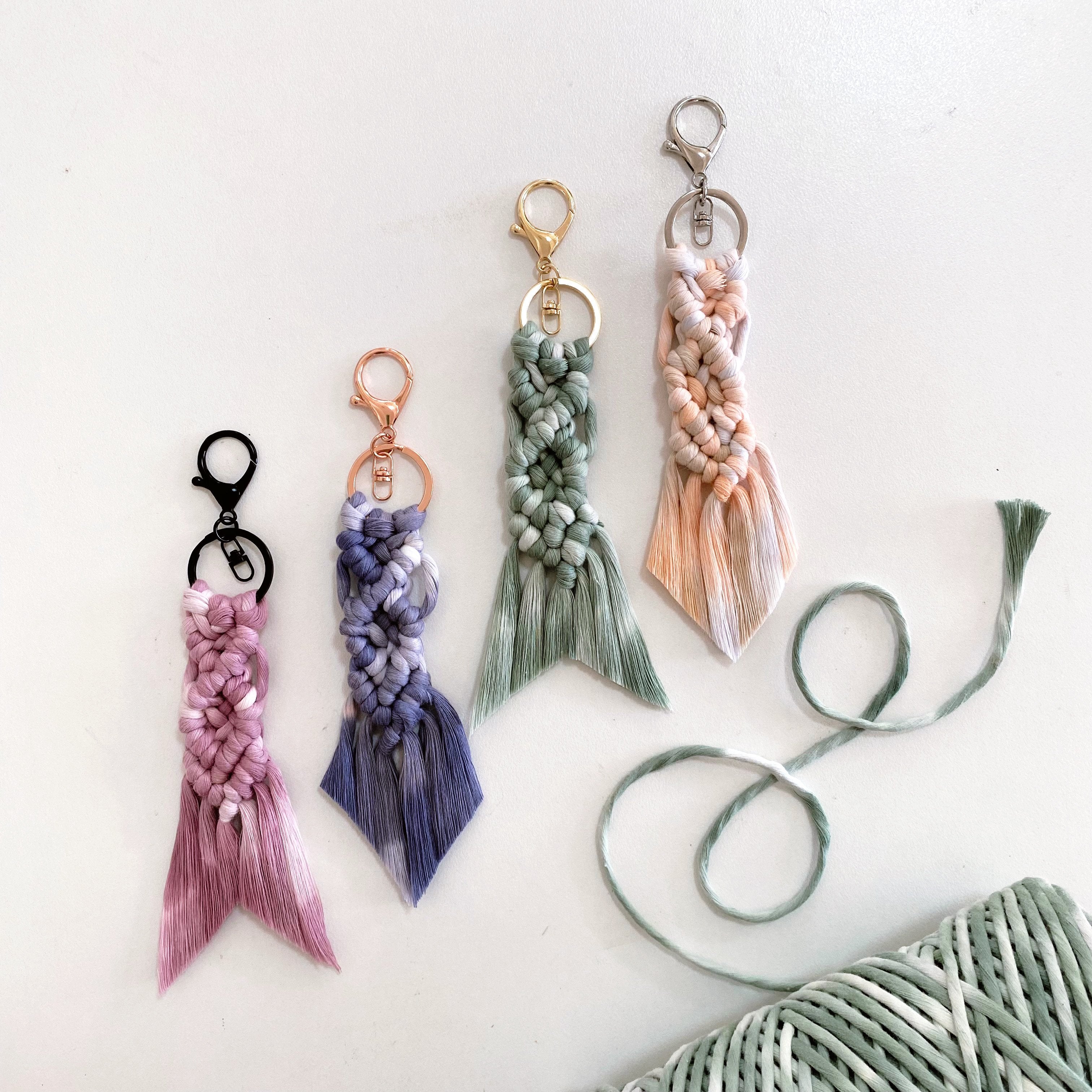 macrame fishtail keyrings laid on angle on white background