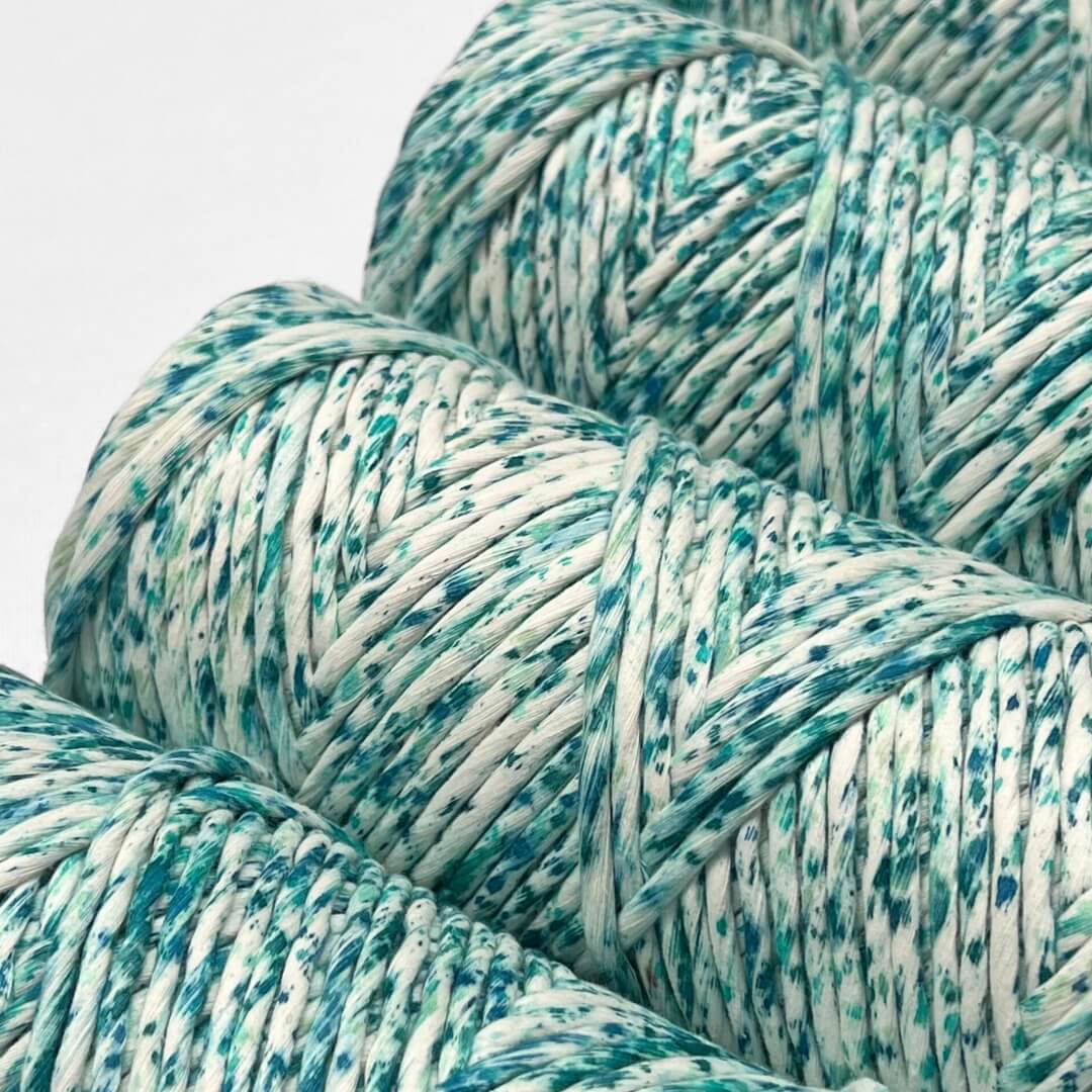 four rolls of blue lagoon colourway stnading side by side on angle on white back ground