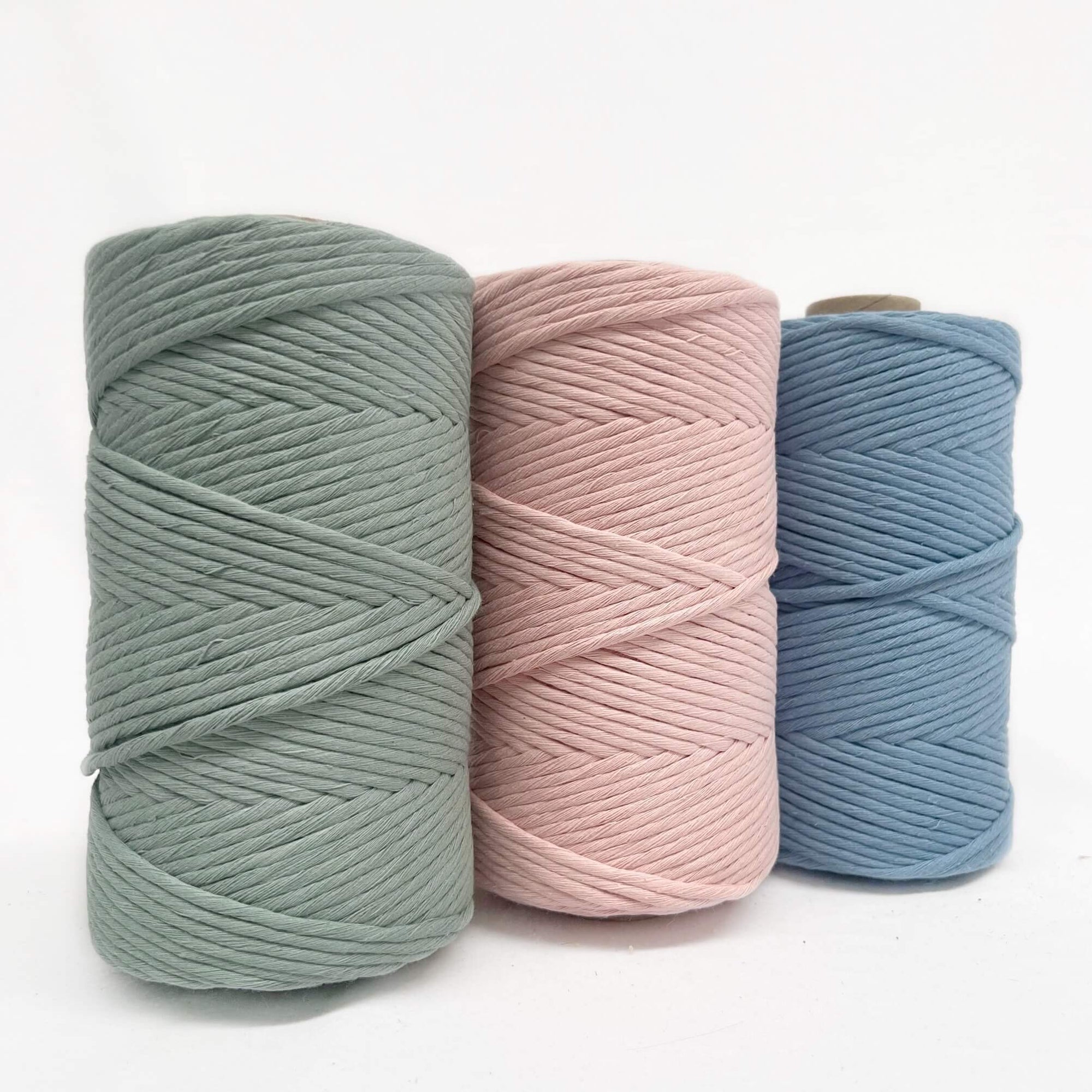 light green soft powder pink faded blue combination photo showing cotton string for workshops on white backdrop