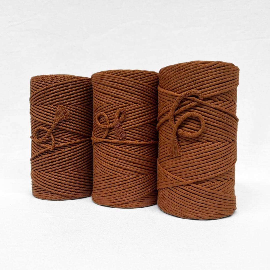 combination image including three rolls of warm brown sugar 4mm cotton recycled cord for macrame and crafts on white background 