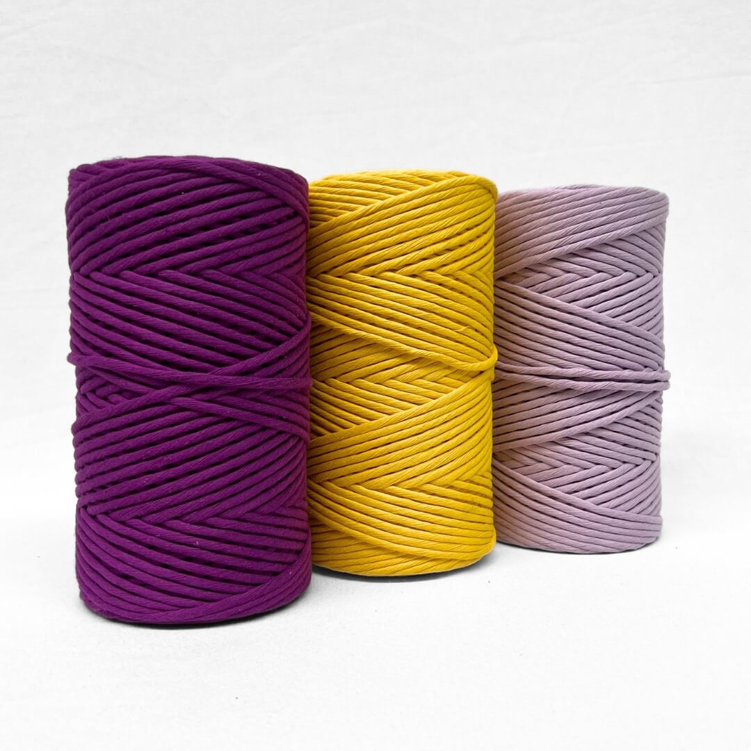 two rolls of string in 3mm and 5mm deep grape purple on white wall