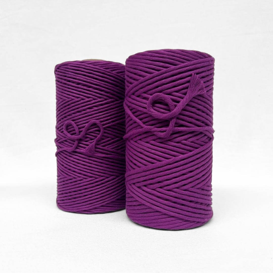 two rolls of string in 3mm and 5mm deep grape purple on white wall