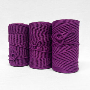 three rolls of grape cotton cord in close up image including 3mm string 5mm string and 4mm rope on white background