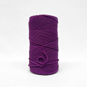 one roll of vibrant grape purple 4mm recycled macrame cord in white background small brushed piece showcasing products softness 