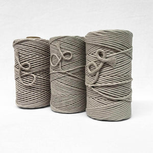 three rolls o latte brown string in different sizes to show different between size and texture