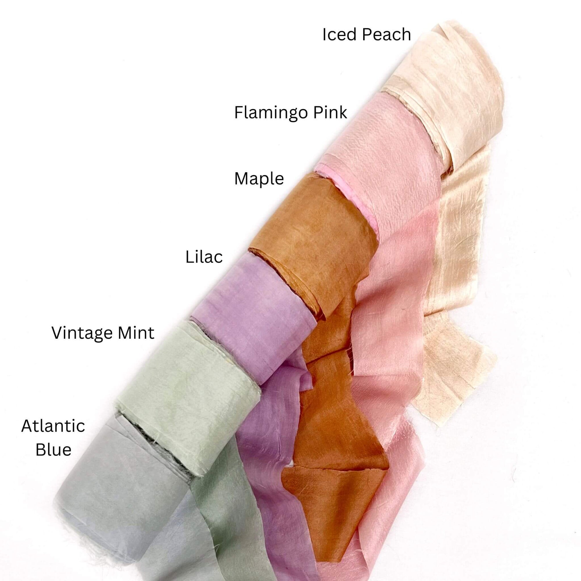 iced peach baby pink maple orange lilac vintage mint grey blue silk ribbon rolls group photo on white background