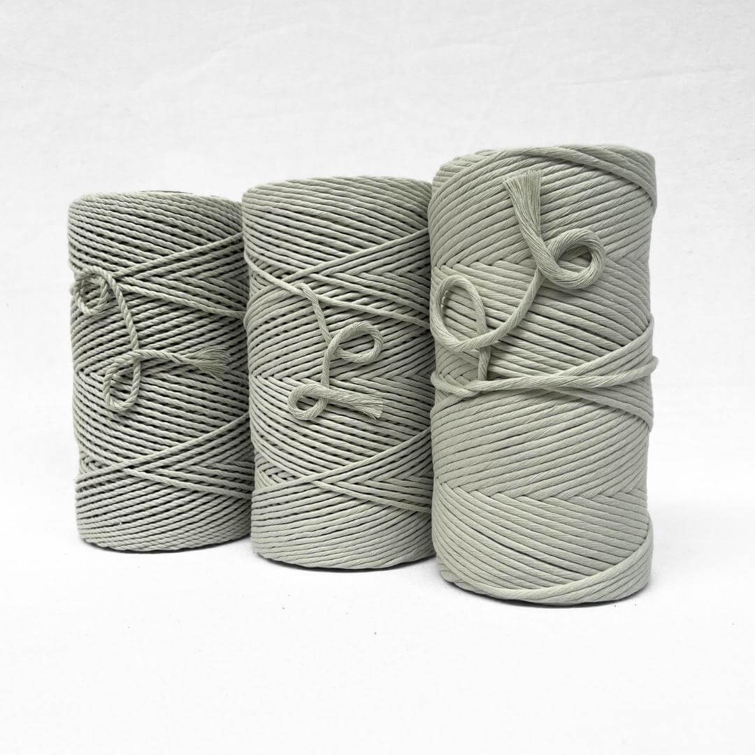 soft muted misty green cotton rope with small brushed out piece to show product softness and texture on white back ground
