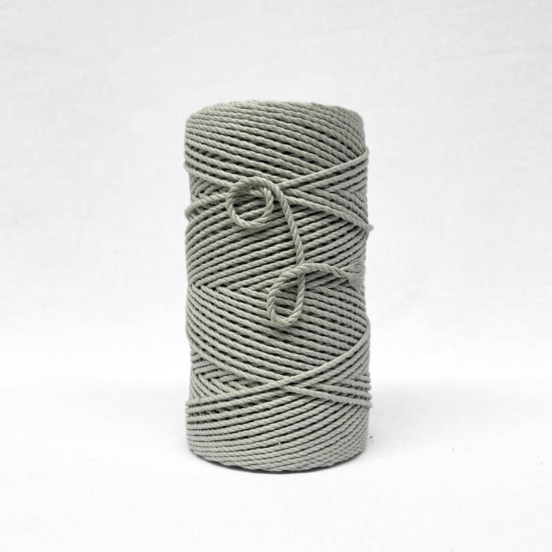 soft muted misty green cotton rope with small brushed out piece to show product softness and texture on white back ground