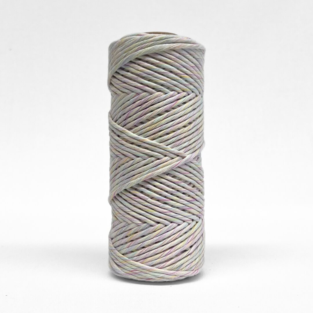 4mm rainbow swirl cotton cord standing upright with white background