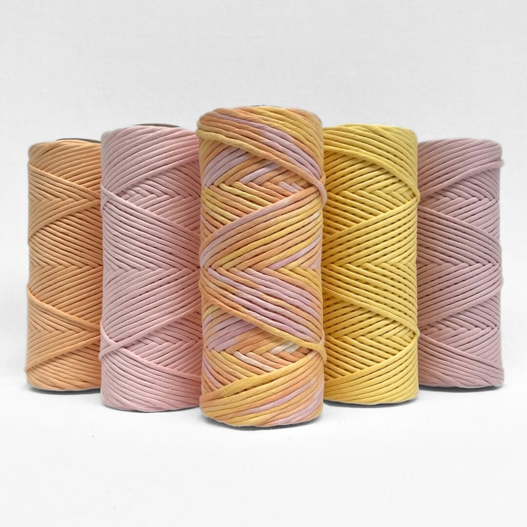 sherbet macrame string standing side by side to complementing colours of macrame string 